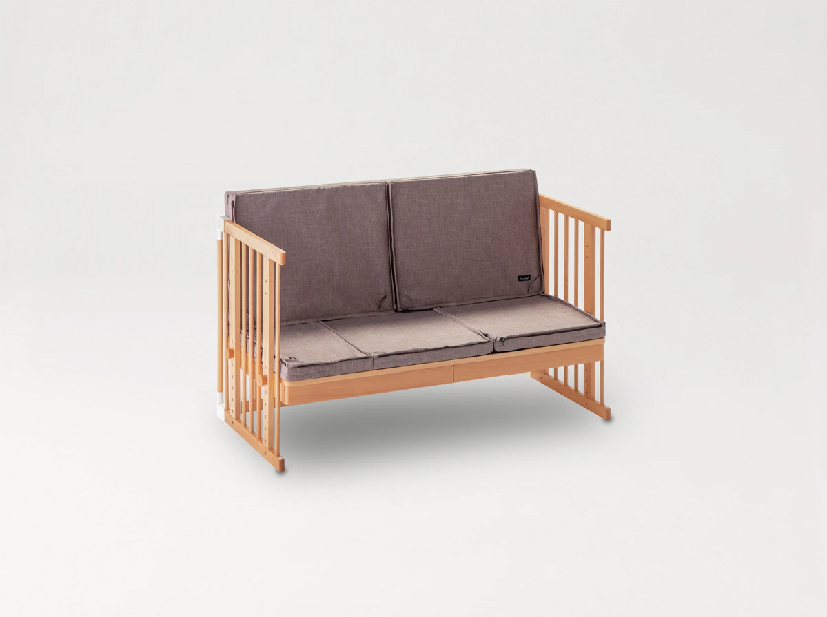 Creative Cot Long converted into a kids' sofa with seat and back cushions in Melange Brown