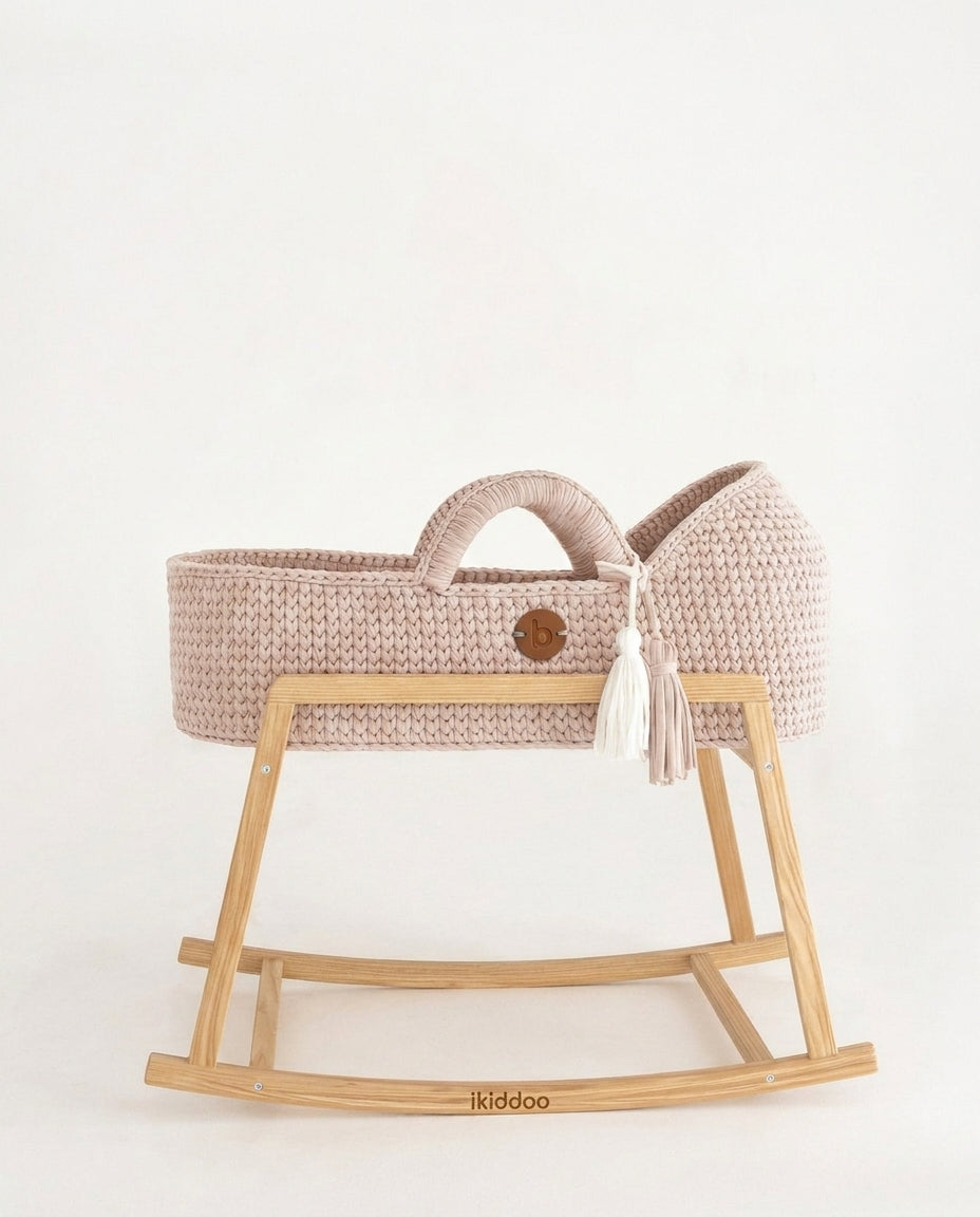 Pearl handwoven Moses basket, side view on the wooden stand