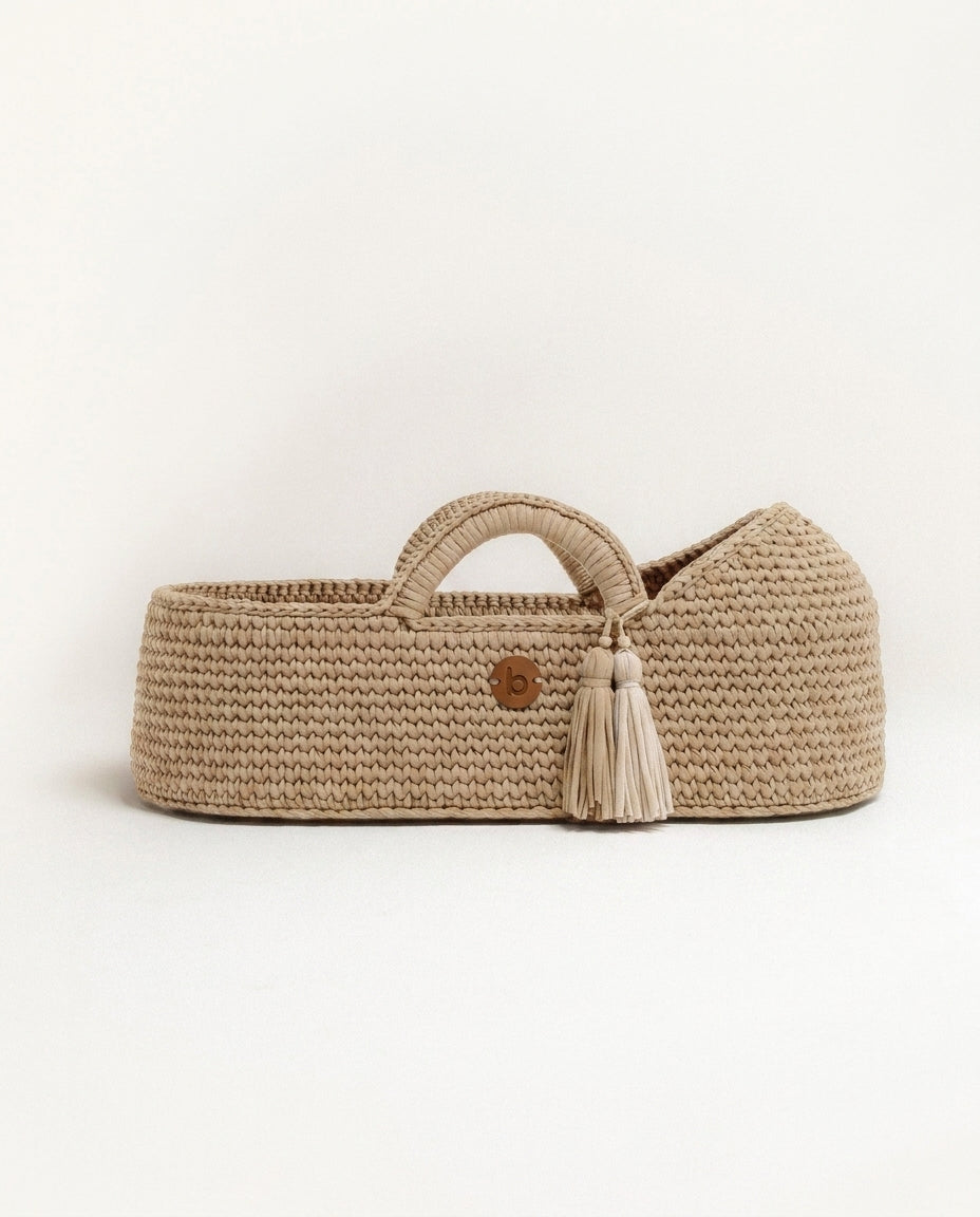 Handwoven Moses basket shown on a clean studio background