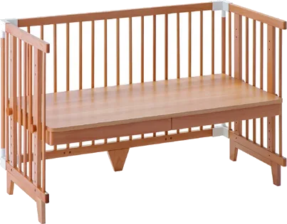 The Creative Cot Long in kids' table mode with a bench