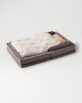 The färska Compact Bed Free in Melange Brown, made up with its quilt and pillow, sides raised #color_melange-brown