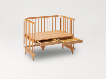 Creative Cot converted into a children's table with two pull-out drawers