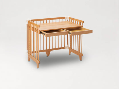 Creative Cot converted into a desk with two pull-out drawers