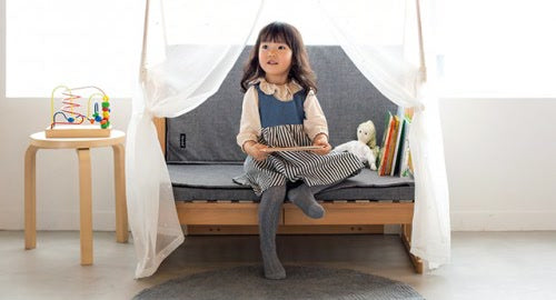 Creative Cot set up as a sofa with Joint Mattress cushions in Melange Gray