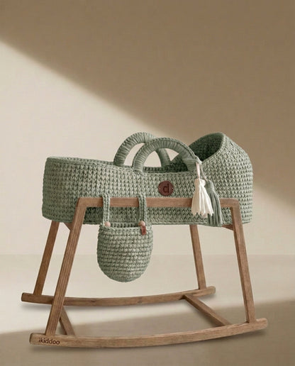 Sage handwoven Moses basket on the wooden rocking stand