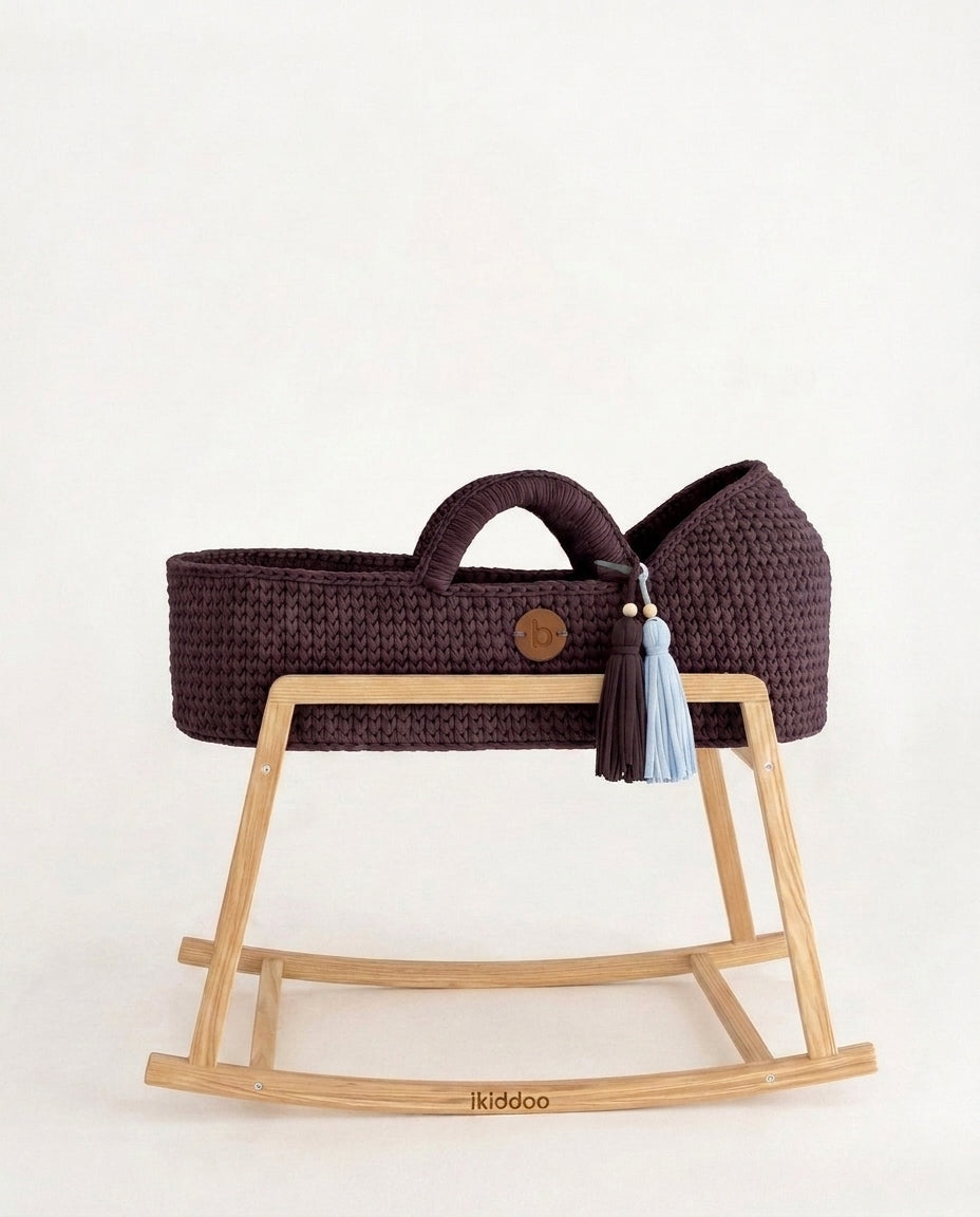 Fig handwoven Moses basket, side view on the wooden stand