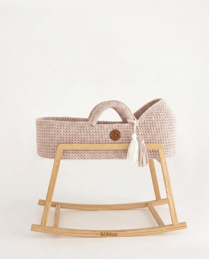 Pearl handwoven Moses basket, side view on the wooden stand