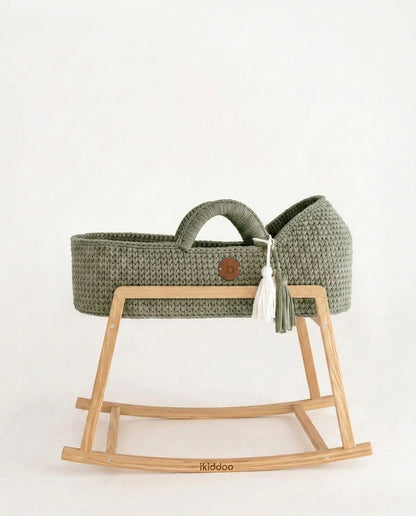 Sage handwoven Moses basket, side view on the wooden stand