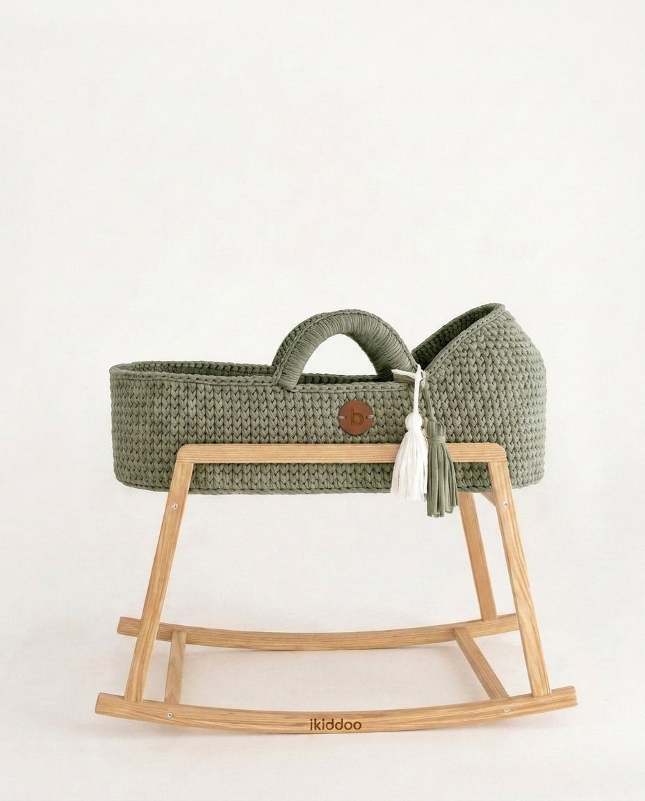 Sage handwoven Moses basket, side view on the wooden stand