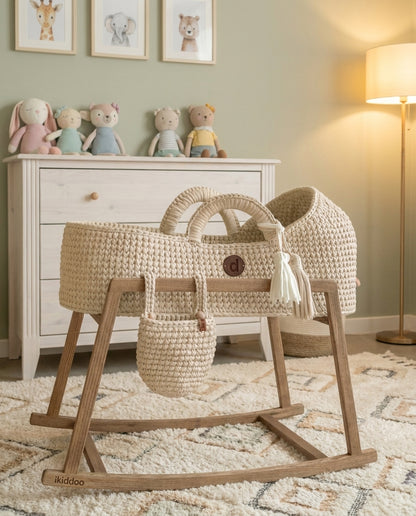 Handwoven Moses basket on a wooden stand in a nursery