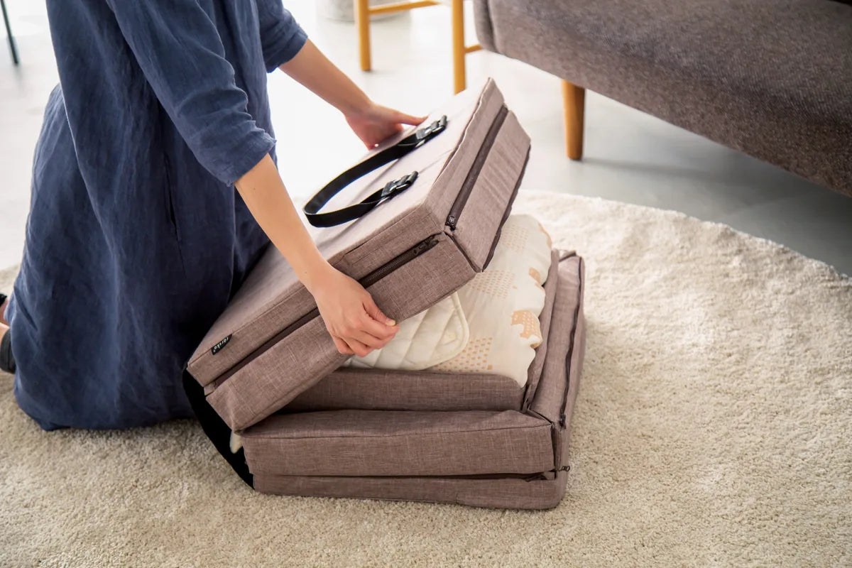 Step 3: fold the bumpers and join the halves by the handle