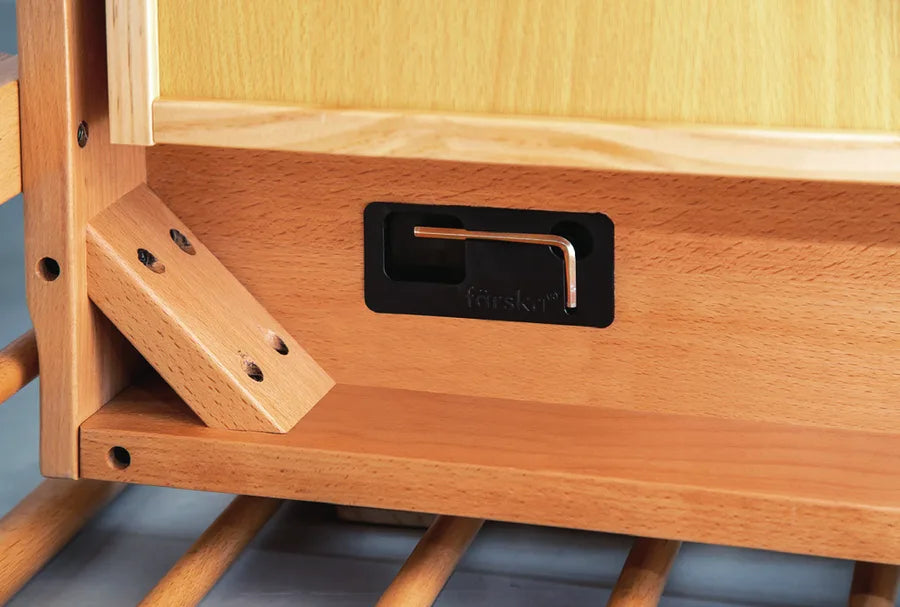 The hex key in its storage slot right in the Creative Cot frame