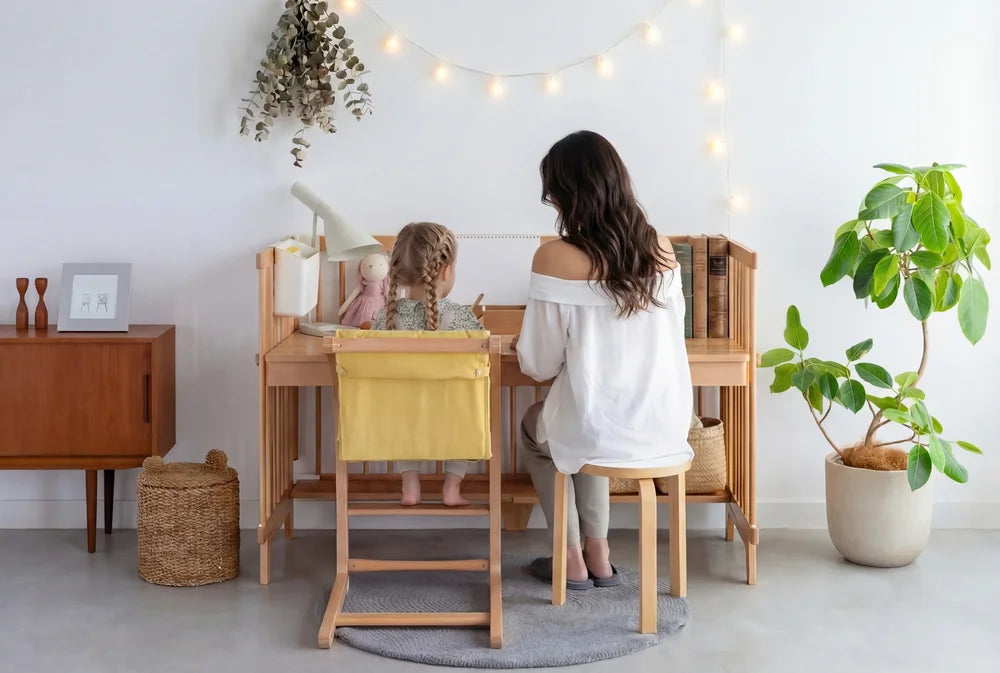 A mother and daughter working together at the Creative Cot Long study desk
