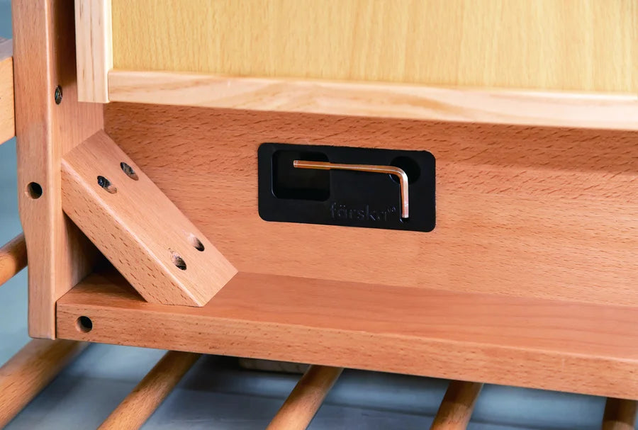 The hex key in its storage slot right in the Creative Cot Long frame