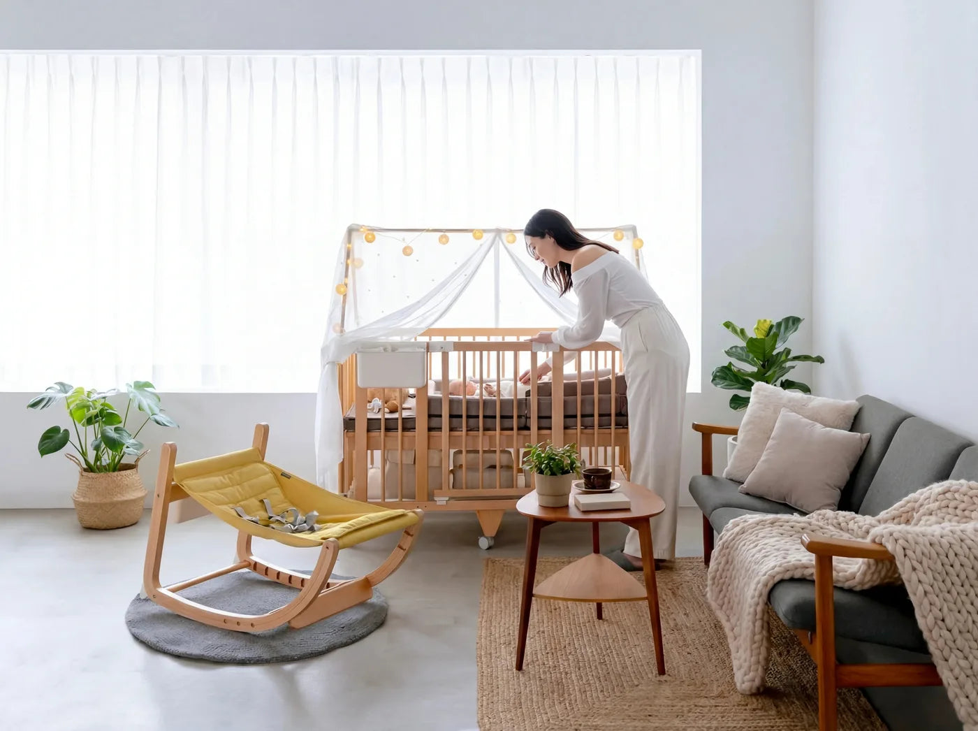 Creative Cot Long with canopy in a living room next to the Scroll Chair rocking chair