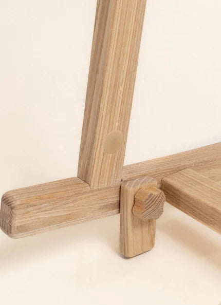 Wooden stand lock in the closed position - the curved rails are blocked