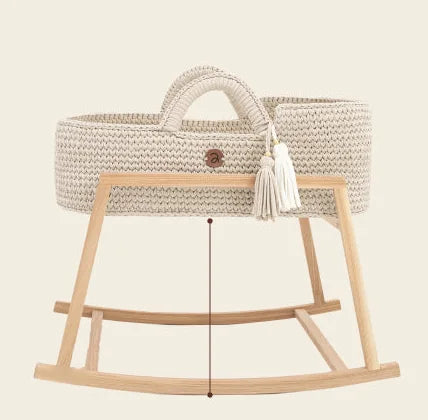 Handwoven Moses basket on the low rocking stand